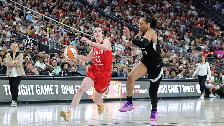 Caitlin Clark #22 of the Indiana Fever drives against A'ja Wilson #22 of the Las Vegas Aces in the third quarter of their game at T-Mobile Arena on June 22, 2025 in Las Vegas, Nevada. The Aces defeated the Fever 89-81. - null