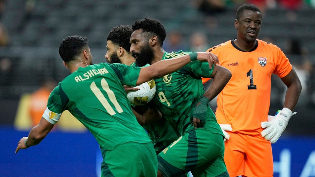 Photo: AP : Saudi Arabia's Feras Albrikan (9) celebrates after scoring against Trinidad and Tobago in their Concacaf Gold Cup clash.