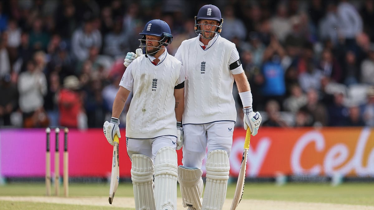 England's Ben Duckett, left, receives a pat from batting partner Joe Root as he walks off the field after losing his wicket on day five of the first cricket test match between England and India at Headingley in Leeds, England, Tuesday, June 24, 2025.

 -  (AP Photo/Scott Heppell)