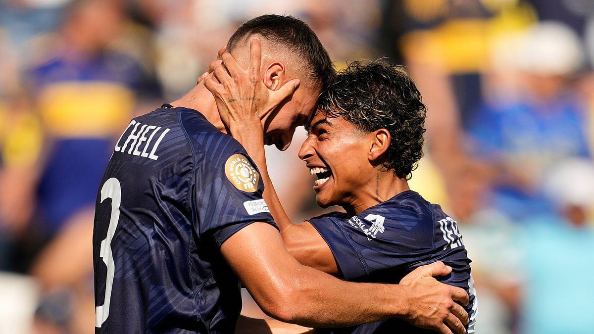 (AP Photo/George Walker IV) : Auckland City's Adam Mitchell, left, and Jerson Lagos celebrate after the Club World Cup Group C soccer match between Auckland City and Boca Juniors in Nashville, Tenn., Tuesday, June 24, 2025.