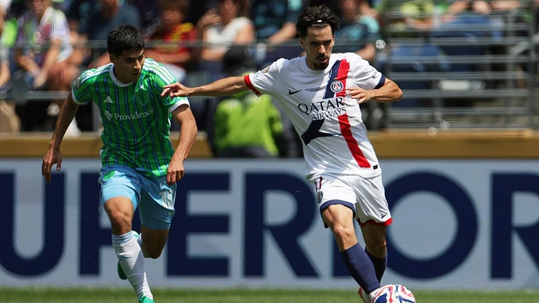 Paris Saint-Germain's Vitinha, right, passes the ball as Seattle Sounders' Obed Vargas looks on during the Club World Cup Group B soccer match between Seattle Sounders and PSG. - AP