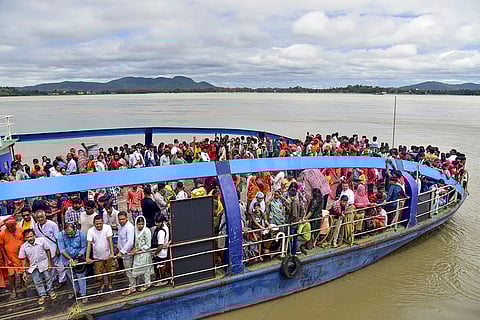People visit Umananda temple