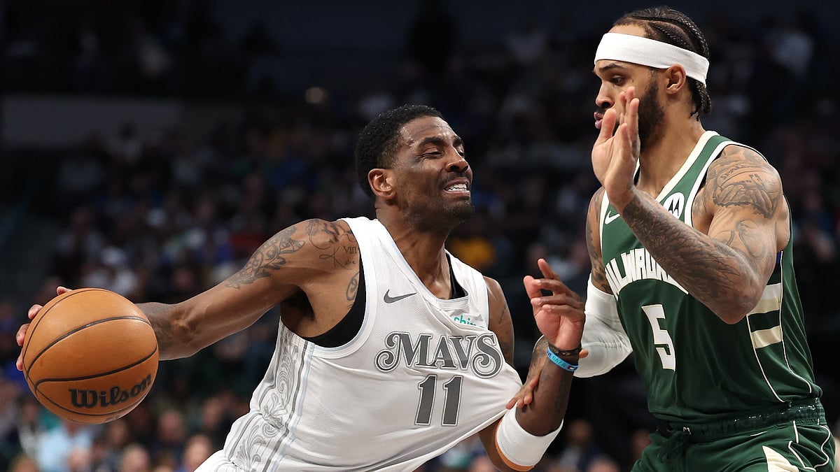 Kyrie Irving #11 of the Dallas Mavericks is defended by Gary Trent Jr. #5 of the Milwaukee Bucks during the second half at American Airlines Center on March 01, 2025 in Dallas, Texas.