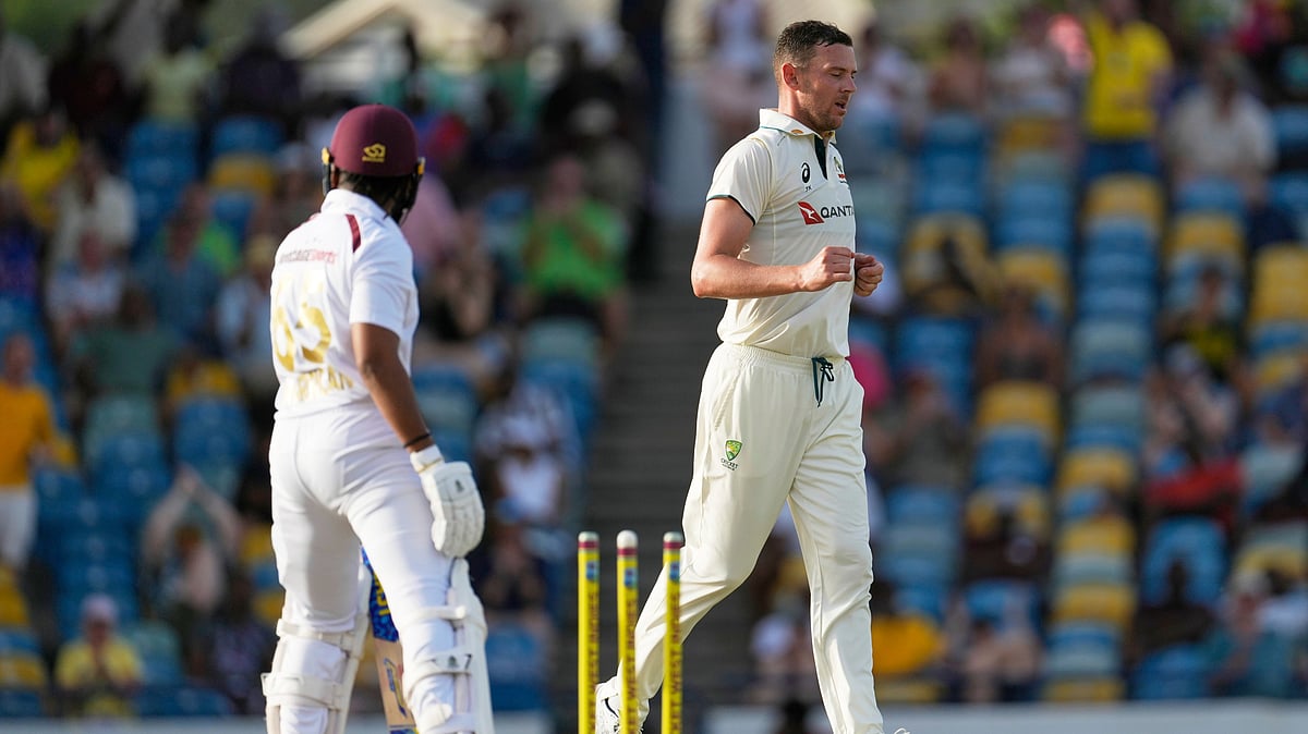 | Photo: AP/Ricardo Mazalan : West Indies vs Australia, 1st Test Day 1: Australia's Josh Hazlewood celebrates the dismissal of West Indies' Jomel Warrican during day one of the first cricket Test match at Kensington Stadium in Bridgetown, Barbados, Wednesday, June 25, 2025.