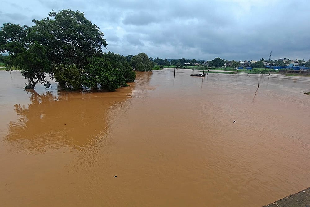 | Photo: PTI : Flooded Markandeya River