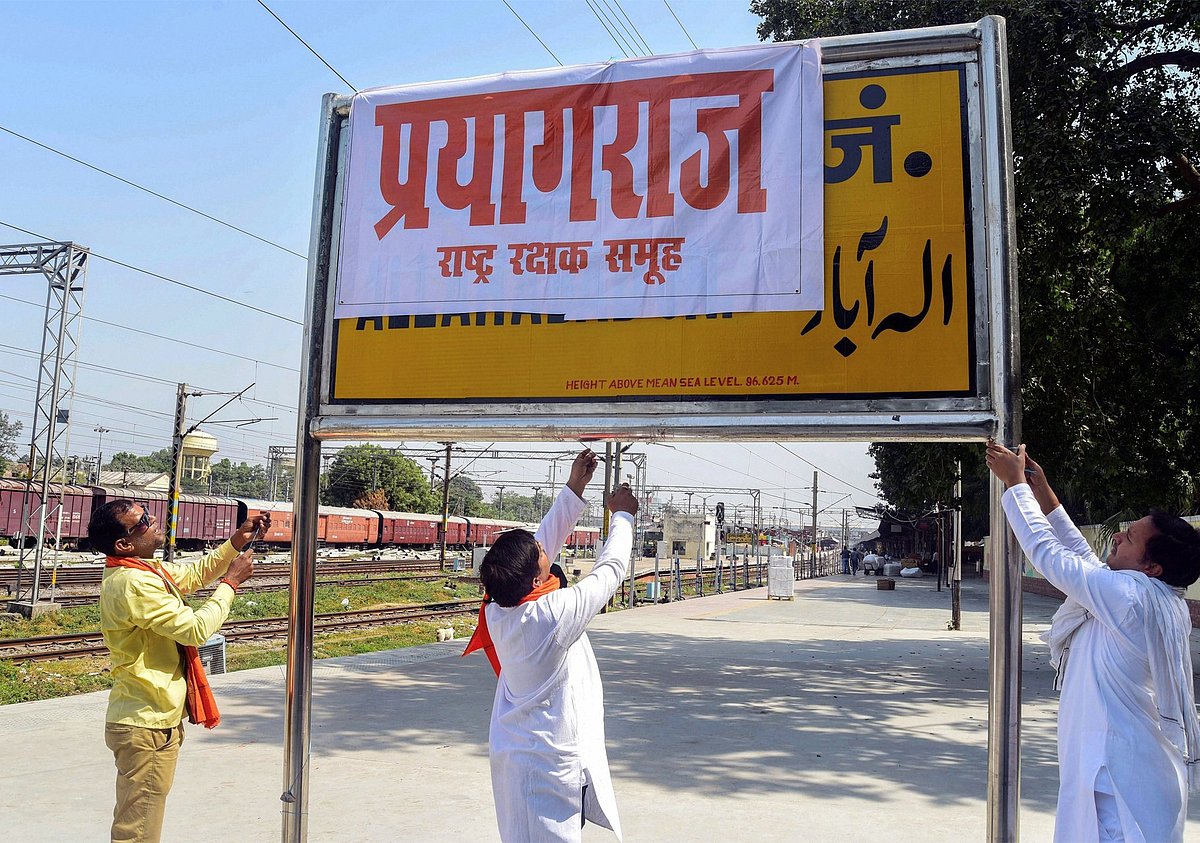 PTI : Activists putting up a banner with the new name at Allahabad station - Prayagraj.