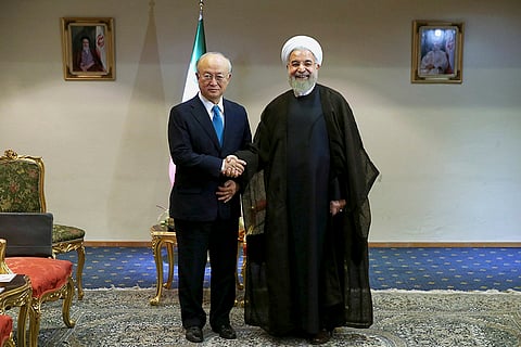 Hassan Rouhani, right, with the Director General of IAEA, Yukiya Amano