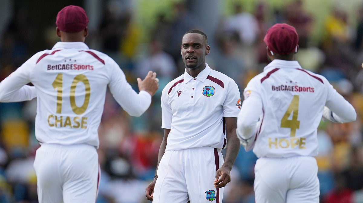 AP Photo/Ricardo Mazalan : West Indies' Jayden Seales celebrates the dismissal of Australia's captain Pat Cummins during day one of the first cricket Test match at Kensington Stadium in Bridgetown, Barbados.