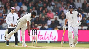 AP Photo/Scott Heppell : India's Jasprit Bumrah, left, bowls a delivery on day five of the first cricket test match between England and India at Headingley in Leeds, England.