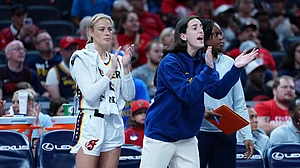 Caitlin Clark watched from the sidelines on Thursday.