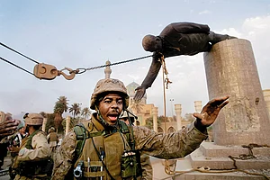 Photo: Getty Images : The Fall: US marines pull down a statue of Saddam Hussein in Baghdad