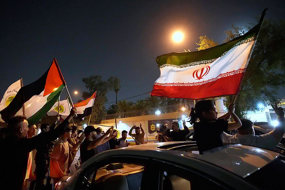 Photo: AP : Protesters gather in front of the Iranian Embassy 