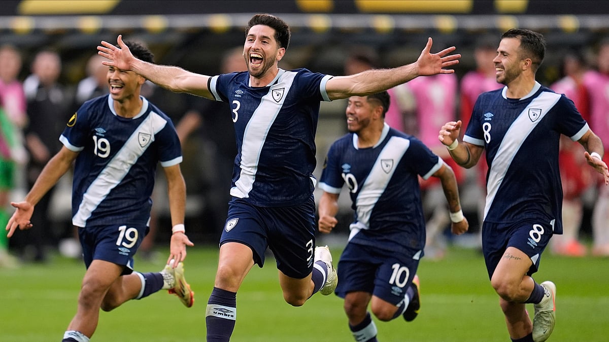 AP Photo/Abbie Parr : Guatemala defender Nicolás Samayoa (3) celebrates with teammates after defeating Canada in penalty kicks during a CONCACAF Gold Cup quarterfinals football match Sunday in Minneapolis.