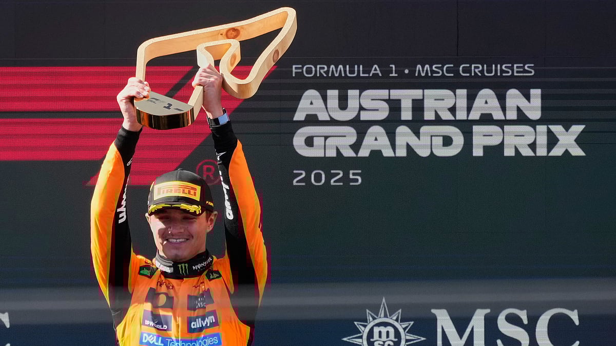  (AP Photo/Darko Bandic) : McLaren driver Lando Norris of Britain holds trophy after winning the Austrian Formula One Grand Prix in Spielberg, Austria, Sunday, June 29, 2025.