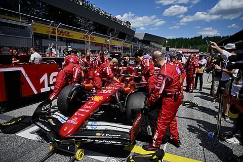 Ferrari driver Charles Leclerc of Monaco sits in his car on the starting grid before the Austrian Formula One Grand Prix in Spielberg, Austria, Sunday, June 29, 2025.

