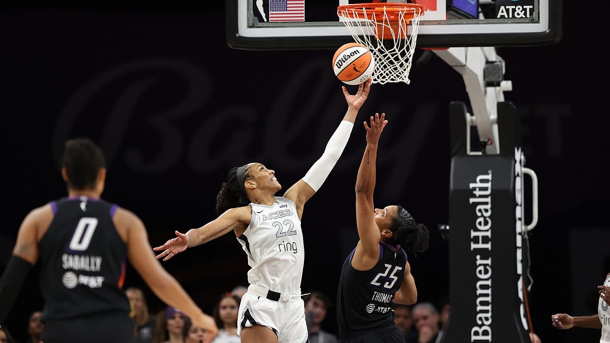A'ja Wilson #22 of the Las Vegas Aces and Alyssa Thomas #25 of the Phoenix Mercury fight for the ball during the second half of the WNBA game at PHX Arena on June 29, 2025 in Phoenix, Arizona.
