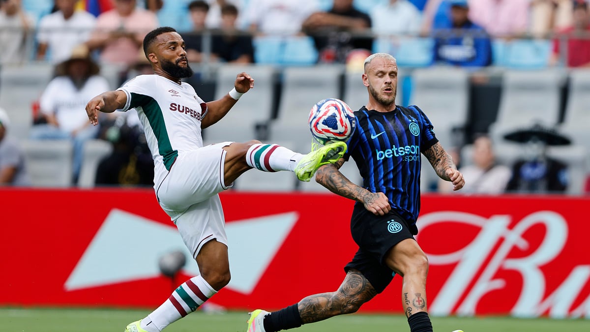 AP Photo/Nell Redmond : Fluminense's Samuel Xavier plays the ball in front of Inter Milan's Federico Dimarco during the Club World Cup round of 16 football match between Inter Milan and Fluminense in Charlotte.
