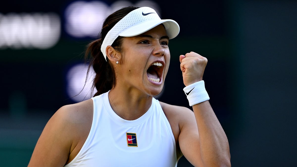 Emma Raducanu celebrates after winning match point versus Mingge Xu