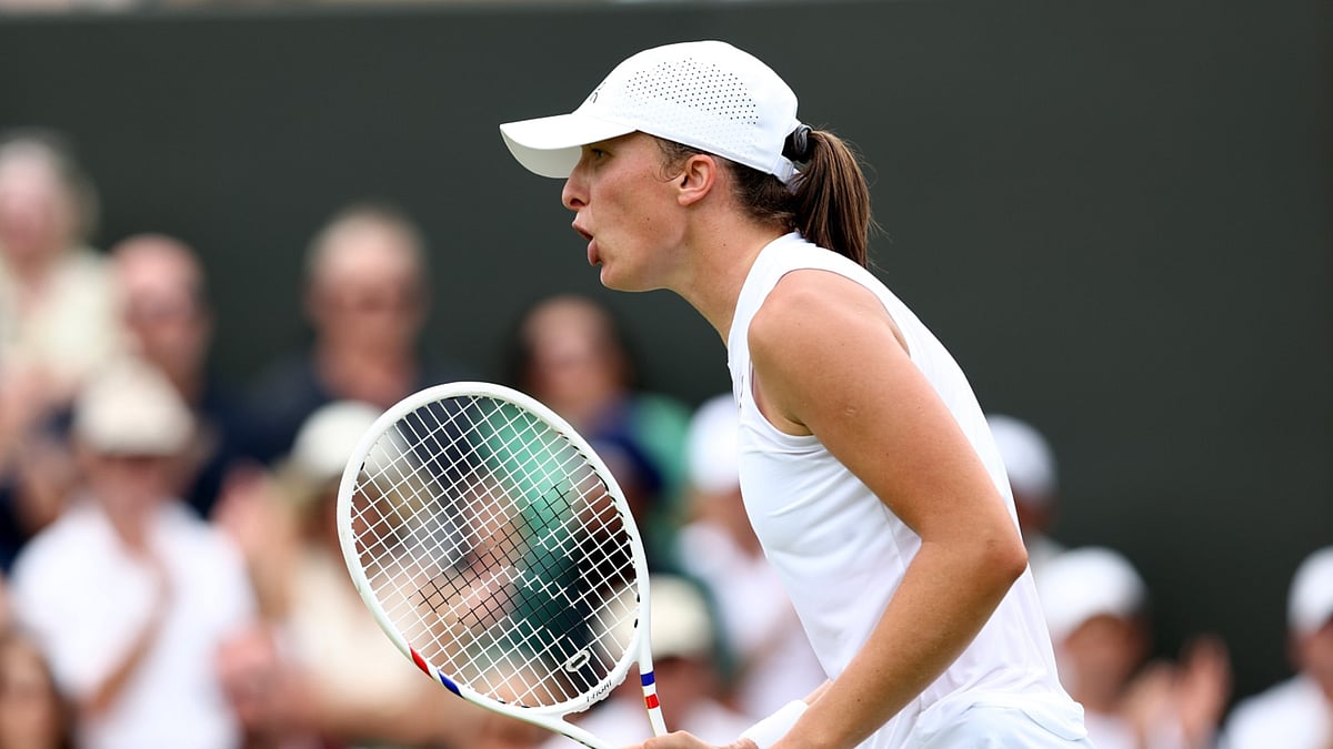 Iga Swiatek in action in the first round at Wimbledon