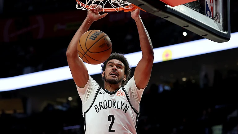 Brooklyn Nets forward Cameron Johnson scores on a dunk vs. the Portland Trail Blazers on Jan. 14, 2025. - null