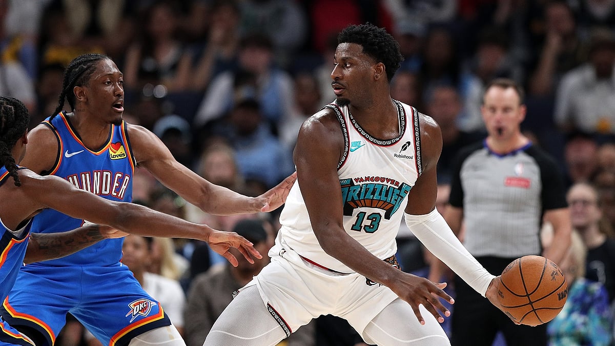 Jaren Jackson Jr. #13 of the Memphis Grizzlies handles the ball against Jalen Williams #8 of the Oklahoma City Thunder during Game Three of the Western Conference First Round NBA Playoffs at FedExForum on April 24, 2025 in Memphis, Tennessee.