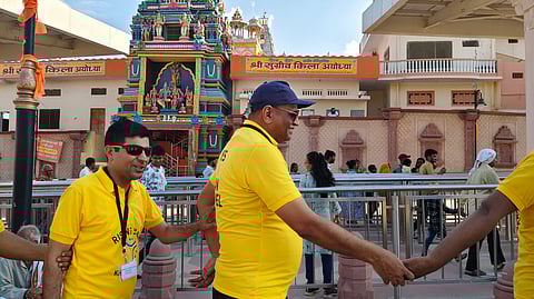 Jagdish Changer being led by other visually impaired people |