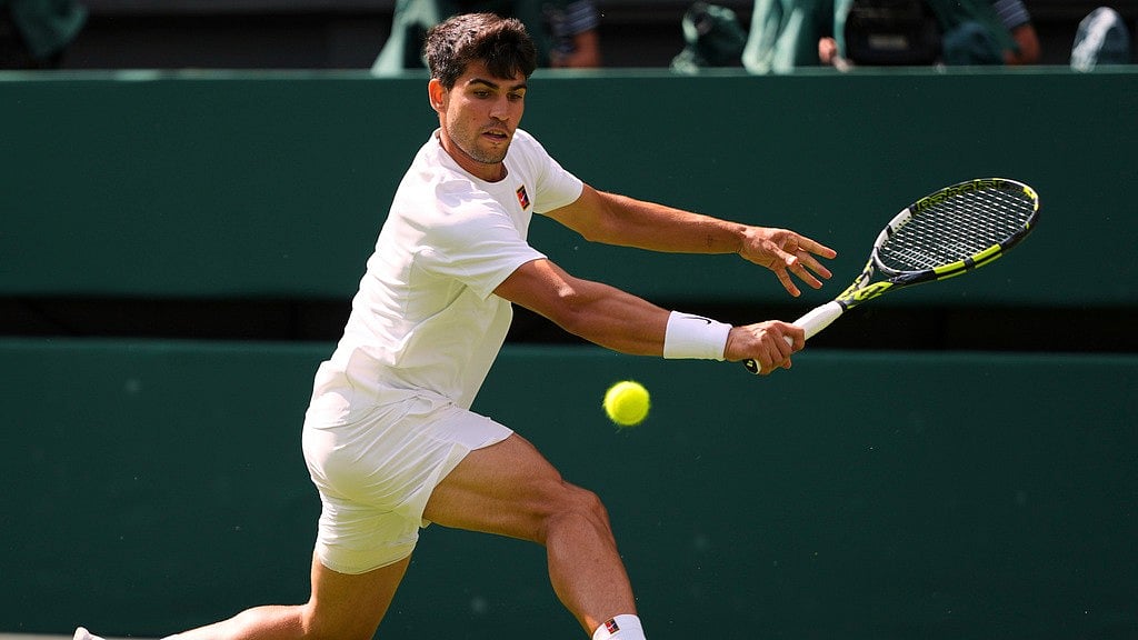 Photo: AP : Wimbledon 2025 Day 3 Highlights: Carlos Alcaraz in action against Oliver Tarvet in the men's singles second round.