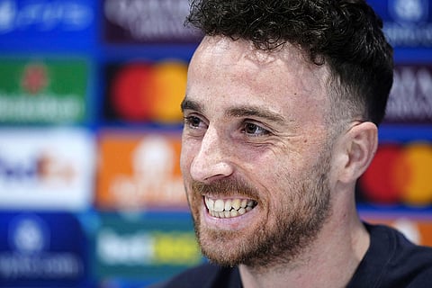 Diogo Jota attends a press conference at Anfield