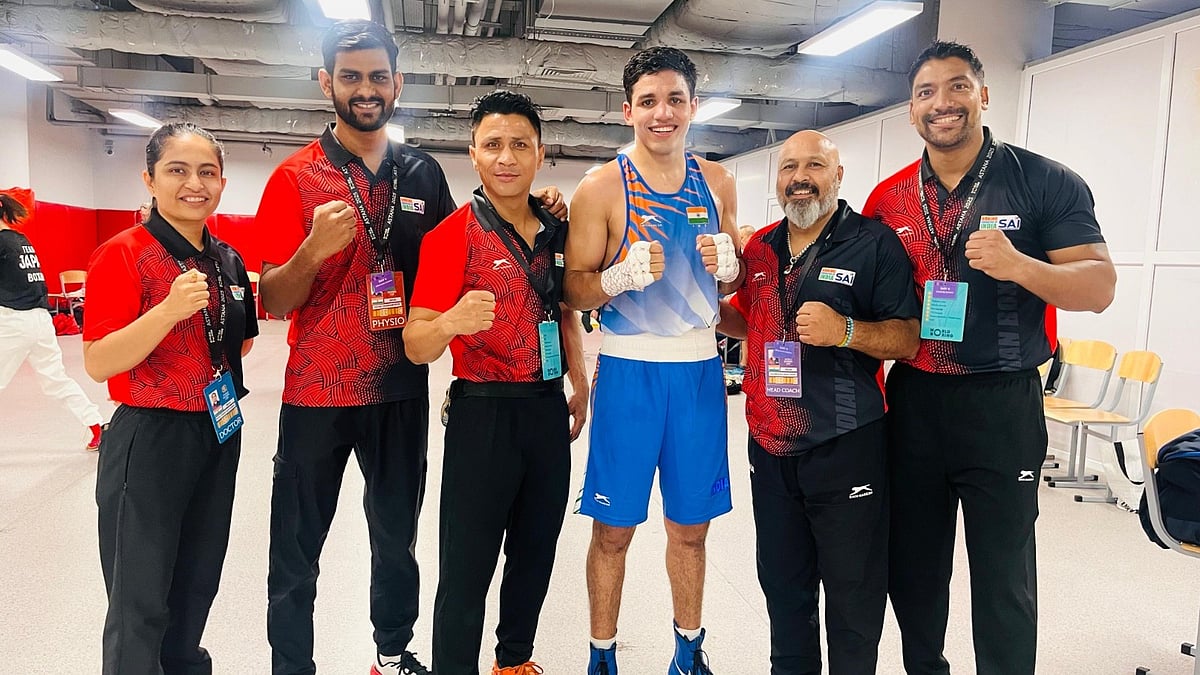 Special Arrangement : Hitesh Gulia (in blue) celebrates after winning his men's 70kg quarter-final bout at the World Boxing Cup.