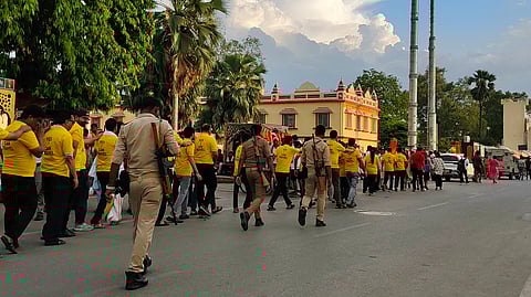 The visually impaired people being assisted by the police at Ayodhya Temple |