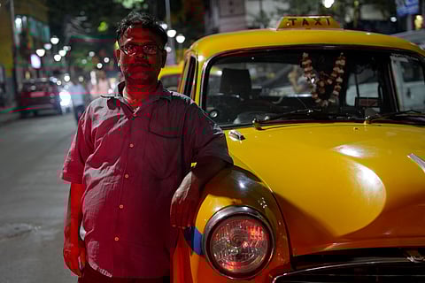 Sambhu Raut came to Kolkata in 1989 from Samastipur district in Bihar. He was 17 years old at the time. Initially, he worked as a helper with a mechanic, but in 1993, he started driving. From the very first day, he drove a yellow taxi. Back then, he earned good money, but now, there is hardly any profit. These days, more people prefer bike taxis. In his opinion, the yellow taxi is a very good vehicle for taxi service. He plans to continue driving it for as long as it lasts, but once it is gone, he will return to his hometown and drive a toto (electric rickshaw). His mother lives there, though his father has passed away. His elder brother works in the BSF. Sambhu owns some land, where he plans to do farming. He is married, and his son is studying at an ITI. He once wanted to join the BSF himself, but he couldn't because his height was lower from the height requirement for BSF.