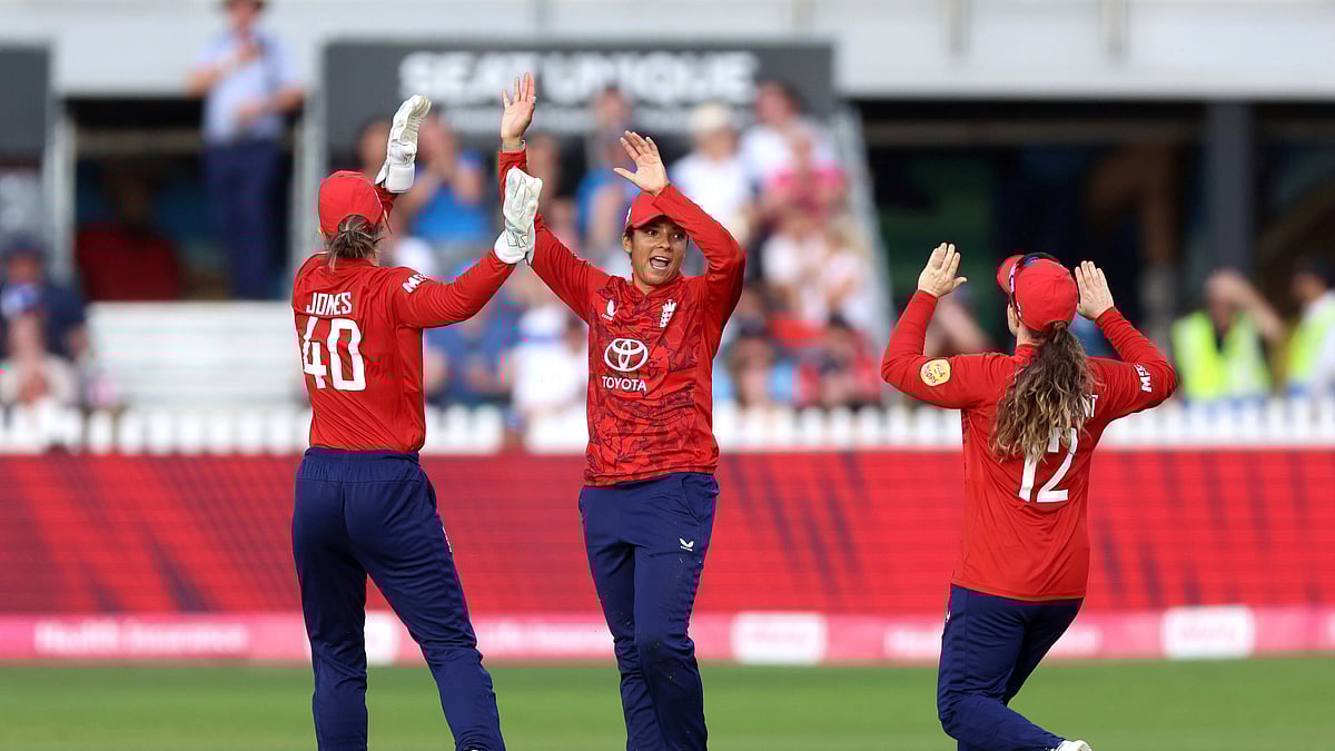 Nigel French/PA via AP : England's Sophia Dunkley, center, celebrates catching out India's Jemimah Rodrigues during the second Women's International T20 Match between England and India at the Seat Unique Stadium, Bristol, England.