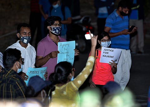 NEW DELHI, INDIA - OCTOBER 15: Members of the Jawaharlal Nehru University Students' Union (JNUSU) protest against the disappearance of Najeeb Ahmed, at North Gate JNU Campus on October 15, 2020 in New Delhi, India. Najeeb Ahmed, a biotechnology student of JNU, went missing on the night of October 15, 2016 from the university. 