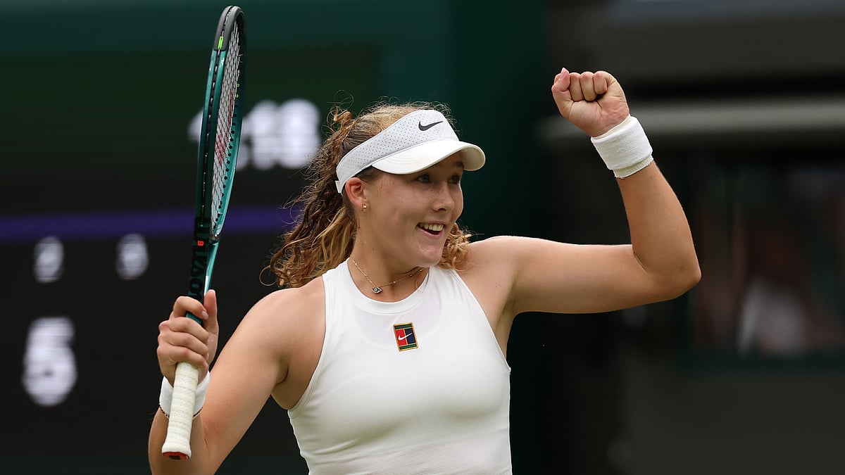 Mirra Andreeva reacts after winning match point.