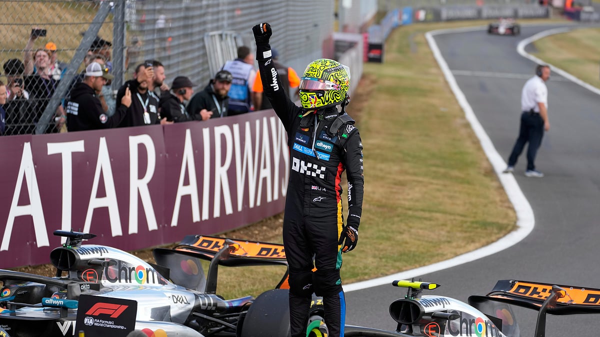 (AP Photo/Darko Bandic) : McLaren driver Lando Norris of Britain celebrates winning the British Formula One Grand Prix race at the Silverstone racetrack in Silverstone, England, Sunday, July 6, 2025.