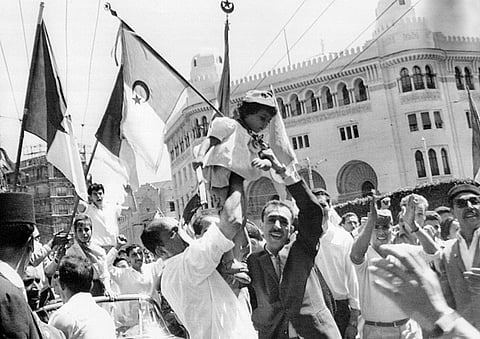 A crowd of Algerians celebrate the independence of Algeria by waving Algerian flags on July 2, 1962 in the European district of Algiers .jpg