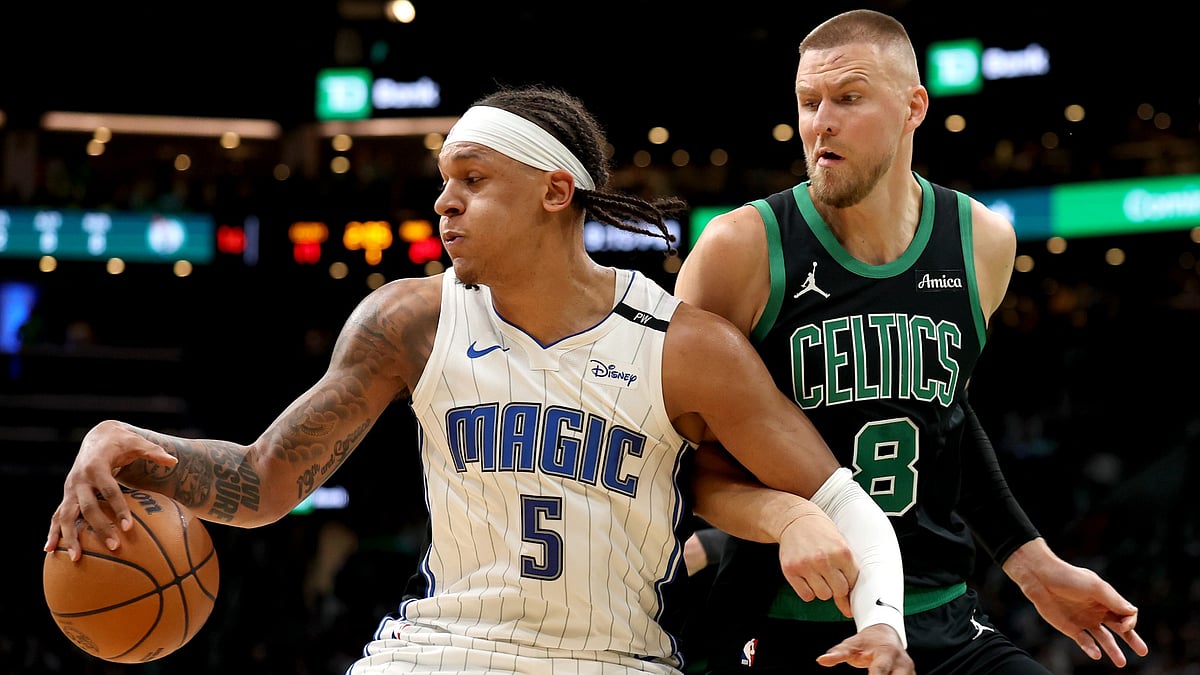 Paolo Banchero #5 of the Orlando Magic controls the ball while defended by Kristaps Porzingis #8 of the Boston Celtics during the first half in Game Five of the Eastern Conference First Round NBA Playoffs at TD Garden on April 29, 2025 in Boston, Massachusetts.