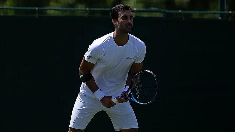 File : Yuki Bhambri and Robert Galloway beat Portugal's Nuno Borges and Marcos Giron 6-3, 7-6 (8-6) in the Wimbledon men's doubles round of 32.