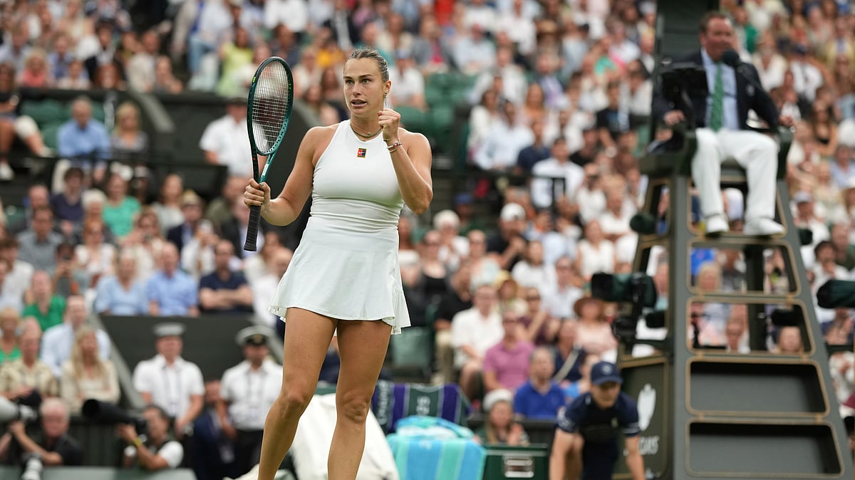 AP Photo/Alastair Grant : Aryna Sabalenka of Belarus celebrates after beating Belgium's Elise Mertens in a fourth-round women's singles match at the Wimbledon Tennis Championships in London.