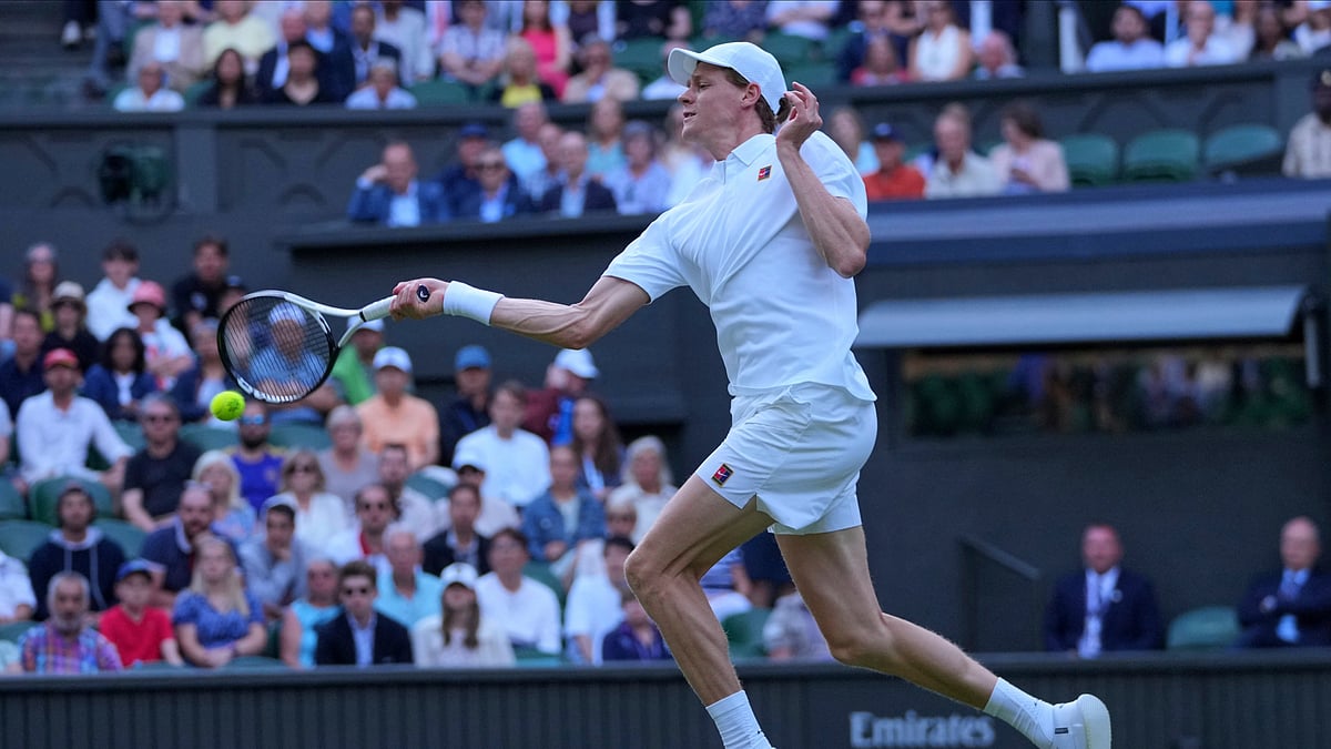 Photo: AP


 : Italy's Jannik Sinner returns to Bulgaria's Grigor Dimitrov during their fourth round men's singles match at the Wimbledon Tennis Championships in London. 