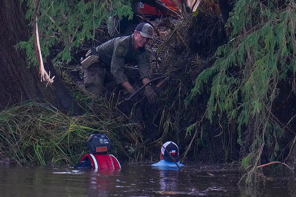 | Photo: AP/Julio Cortez : Texas Floods