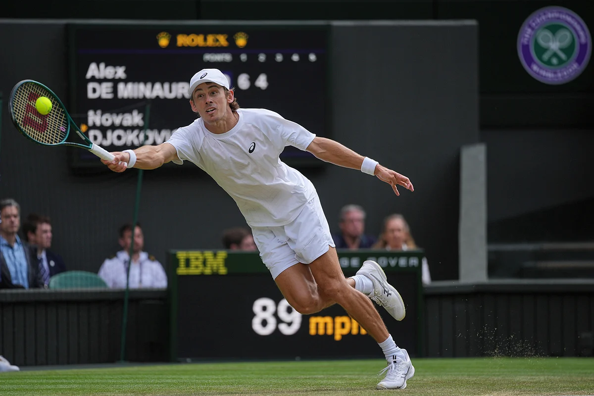 Australia's Alex de Minaur returns to Serbia's Novak Djokovic during a fourth round men's singles match at the Wimbledon Tennis Championships in London, Monday, July 7, 2025. 