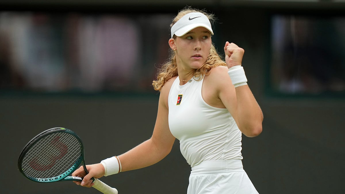 AP Photo/Alastair Grant : Mirra Andreeva of Russia reacts during her women's singles third round match against Hailey Baptiste of the U.S. at the Wimbledon Tennis Championships in London.