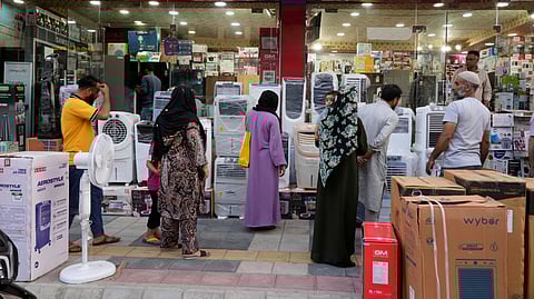 People purchase air conditioners at a shop on a hot summer day in Srinagar, Indian-controlled Kashmir, Tuesday, June 24, 2025.