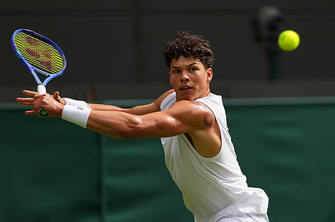 Ben Shelton of the U.S. plays a return to Lorenzo Sonego of Italy during the men's singles fourth round match at the Wimbledon Tennis Championships in London, Monday, July 7, 2025.
