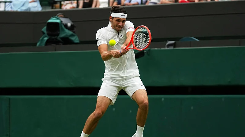 Taylor Fritz of the U.S. plays a return to Jordan Thompson of Australia. AP
