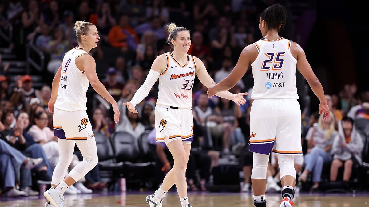 Phoenix Mercury players Sami Whitcomb (center) and Alyssa Thomas celebrate vs. the Dallas Wings on July 7, 2025.