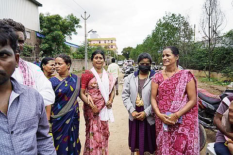 Hapless Victims: Family members of Justin—who is still missing—awaiting authorisation to enter the factory premises