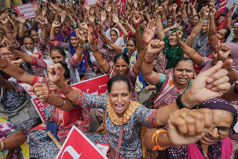 - Rural child care workers shout slogans during a nationwide strike in Ahmedabad, India, Wednesday, July 9, 2025 - AP Photo/Ajit Solanki