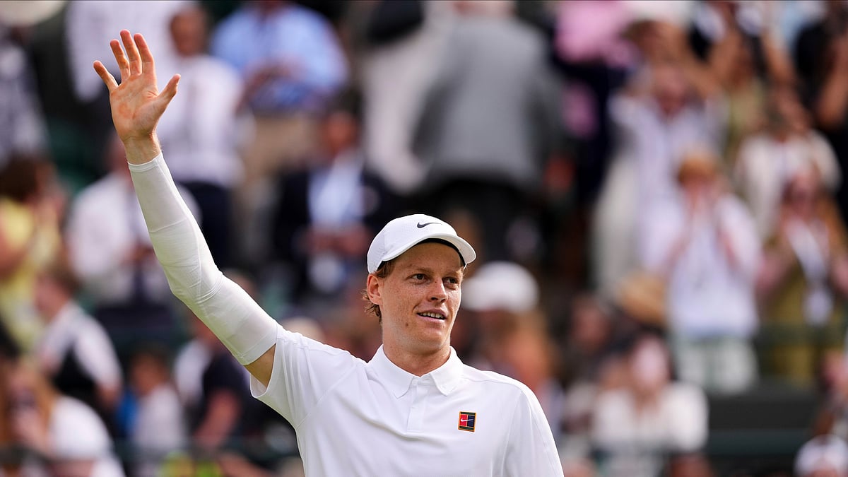 AP Photo/Kirsty Wigglesworth : Jannik Sinner of Italy celebrates winning the men's singles quarter final match against Ben Shelton of the U.S. at the Wimbledon Tennis Championships in London.